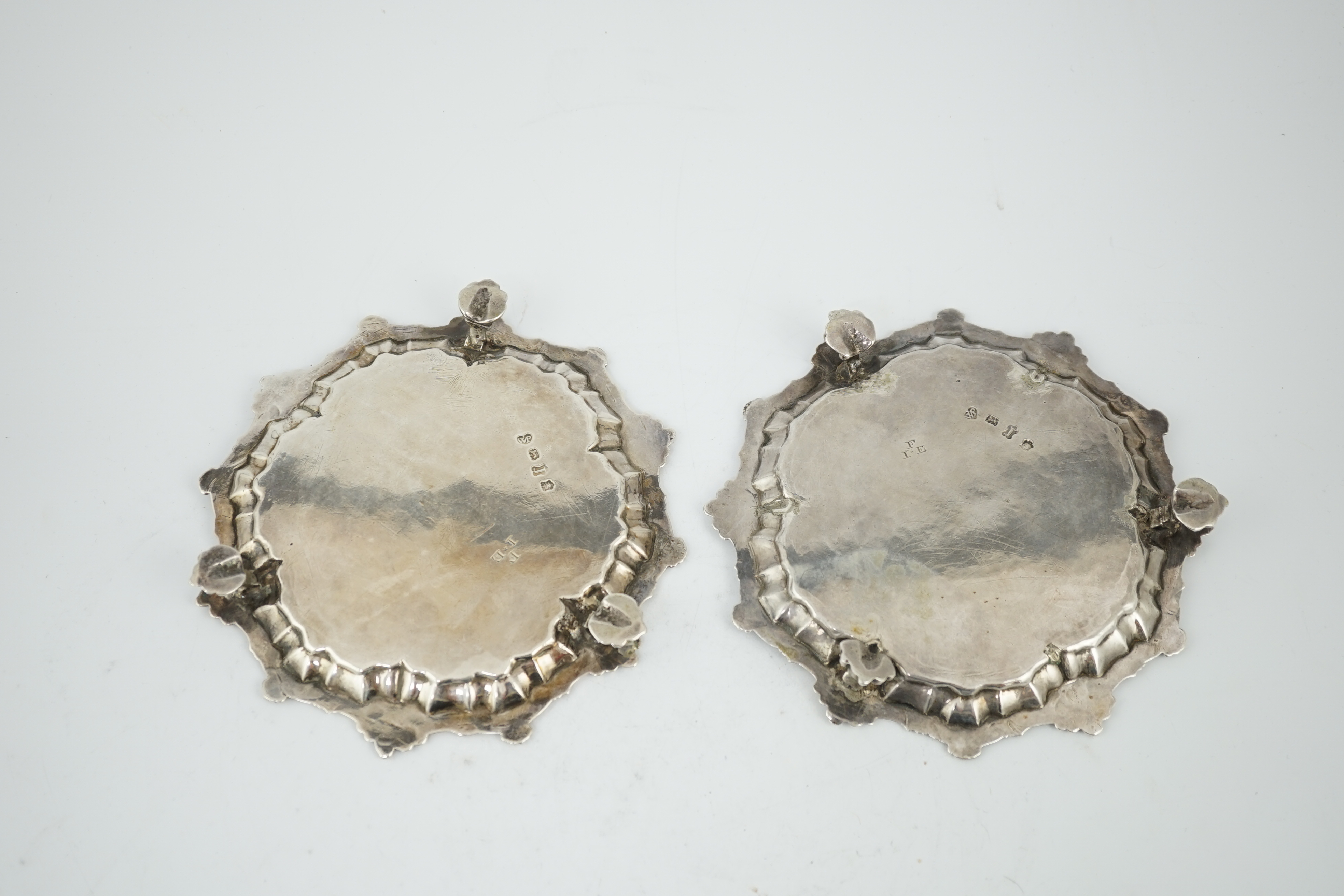 A pair of George II silver waiters, by William Peaston